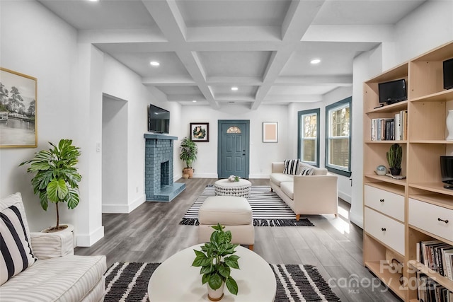 interior space with recessed lighting, coffered ceiling, beamed ceiling, and wood finished floors