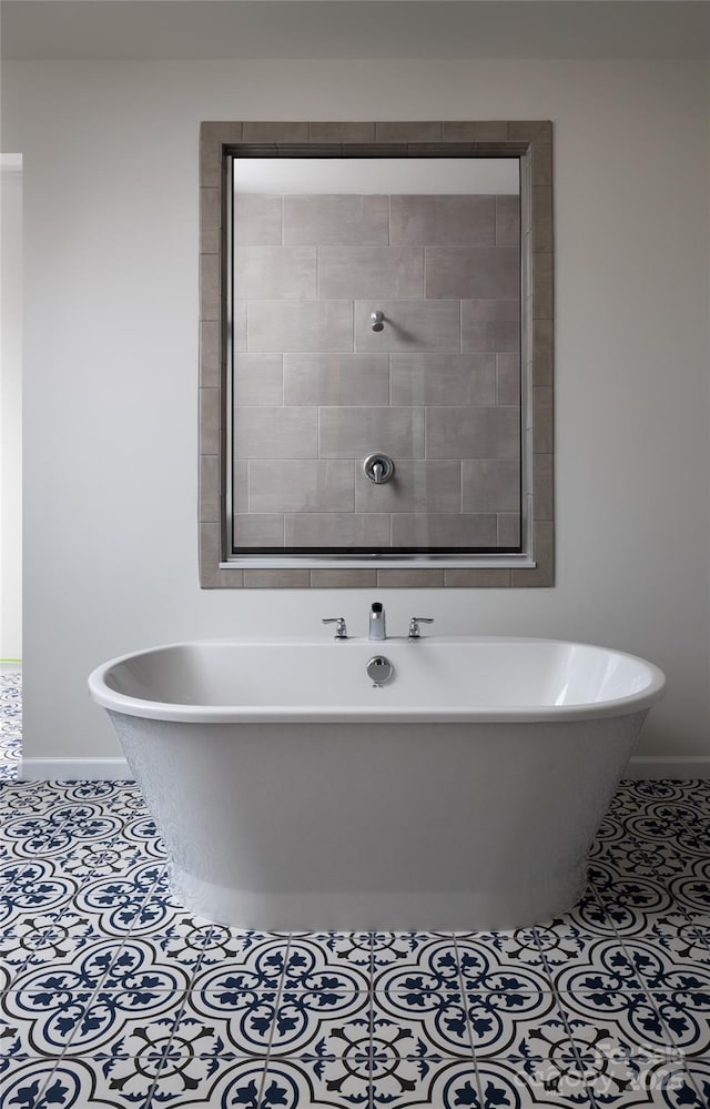 bathroom featuring tile patterned flooring and a tub