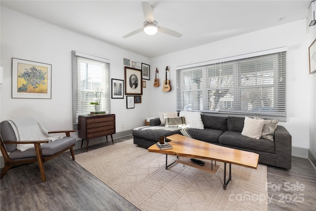 living room featuring hardwood / wood-style flooring and ceiling fan