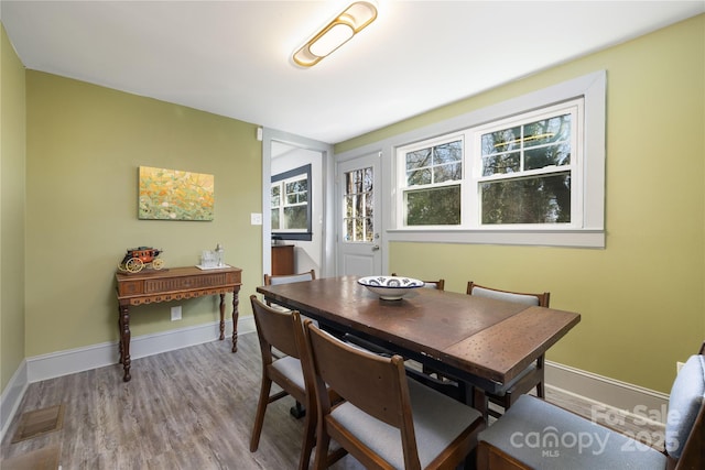 dining room with hardwood / wood-style floors