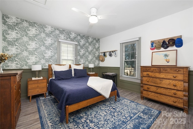 bedroom with hardwood / wood-style flooring and ceiling fan