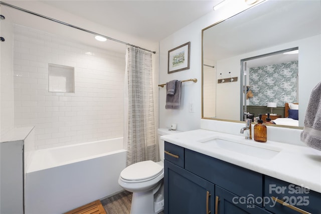 full bathroom featuring vanity, toilet, hardwood / wood-style floors, and shower / bath combo