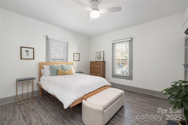 bedroom with dark wood-type flooring and ceiling fan