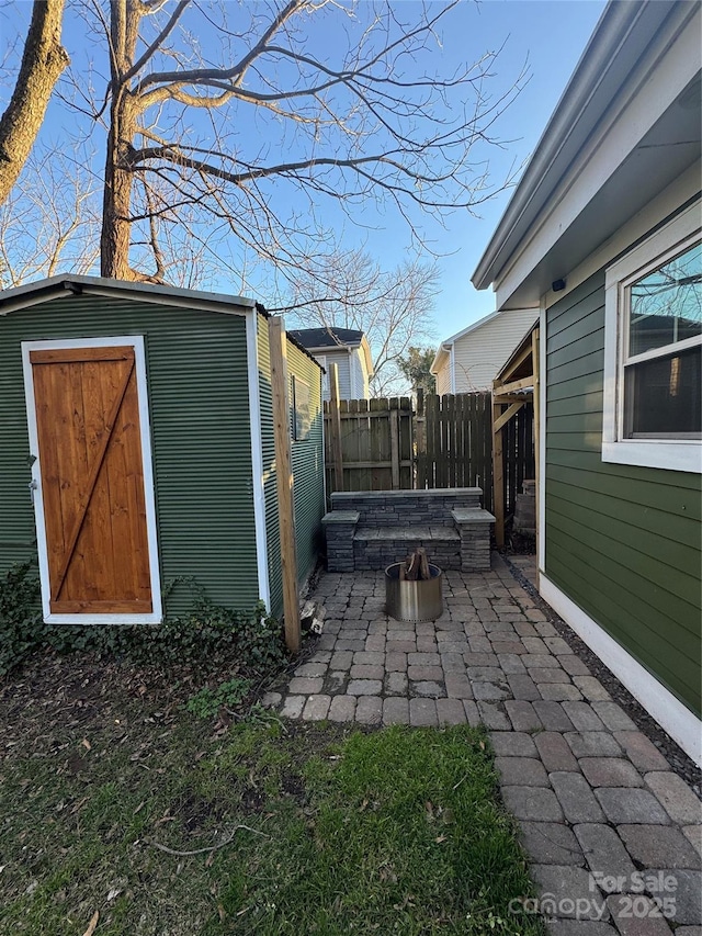 view of yard with an outbuilding and a patio