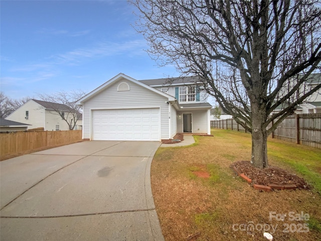 view of front of home featuring a garage and a front lawn