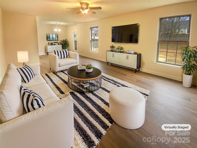 living room with hardwood / wood-style flooring and ceiling fan