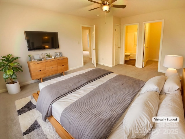 carpeted bedroom with ceiling fan and ensuite bathroom