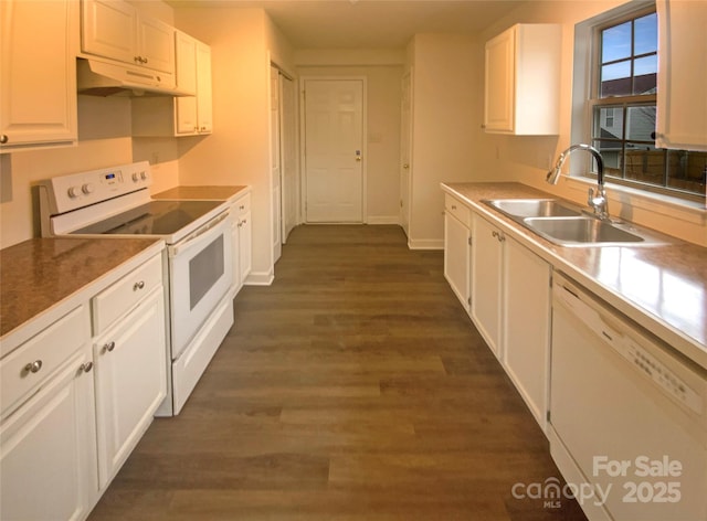 kitchen featuring white cabinetry, sink, dark wood-type flooring, and white appliances