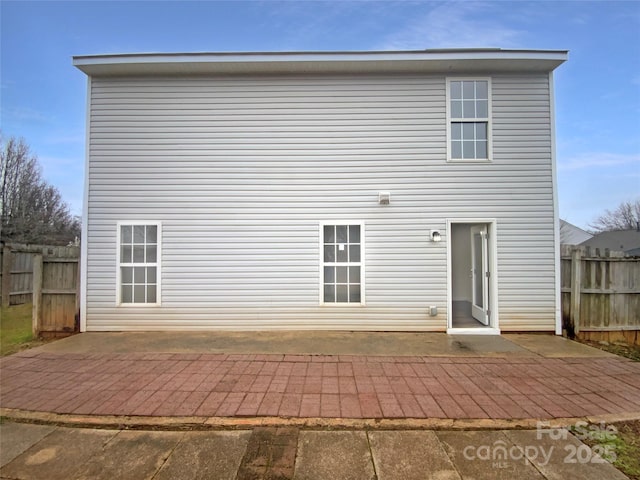 rear view of property featuring a patio area