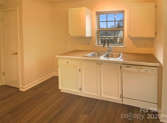 kitchen with white dishwasher, sink, white cabinetry, and dark wood-type flooring