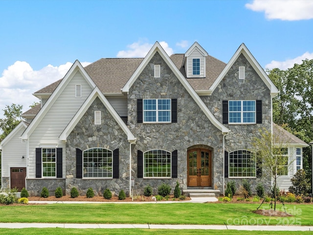 view of front of house featuring french doors and a front lawn