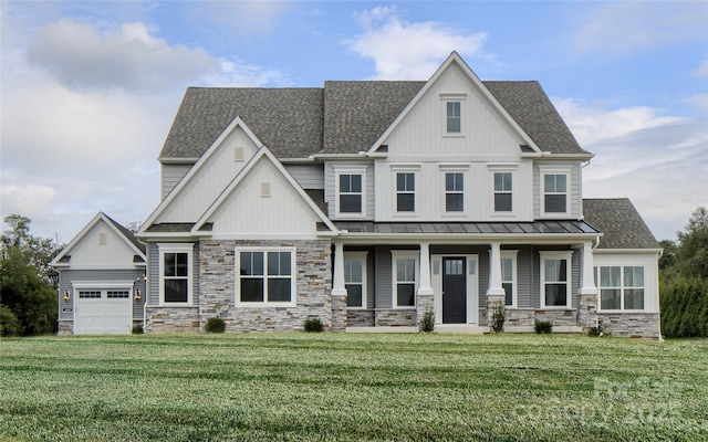 craftsman-style home with a porch, a garage, and a front yard