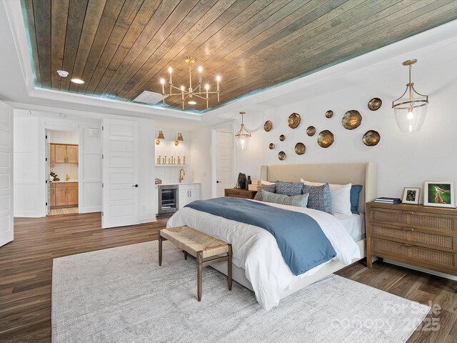Lot11 Mayes Meadow Drive Devonshire, Cornelius, NC 28078 - bedroom with a tray ceiling, wood ceiling, dark wood-type flooring, a chandelier, and beverage cooler