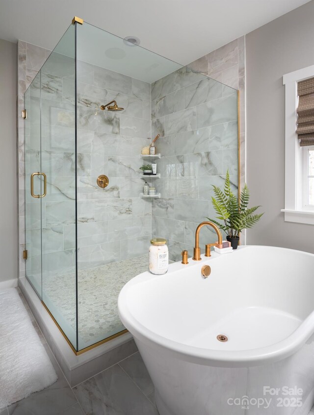 Lot11 Mayes Meadow Drive Devonshire, Cornelius, NC 28078 - bathroom featuring a shower stall, a freestanding tub, and marble look tiles