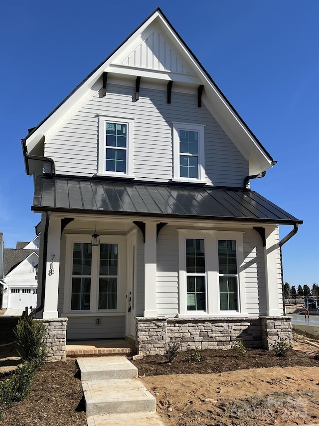 view of front facade featuring a garage and covered porch