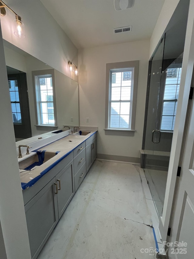 bathroom with vanity and an enclosed shower