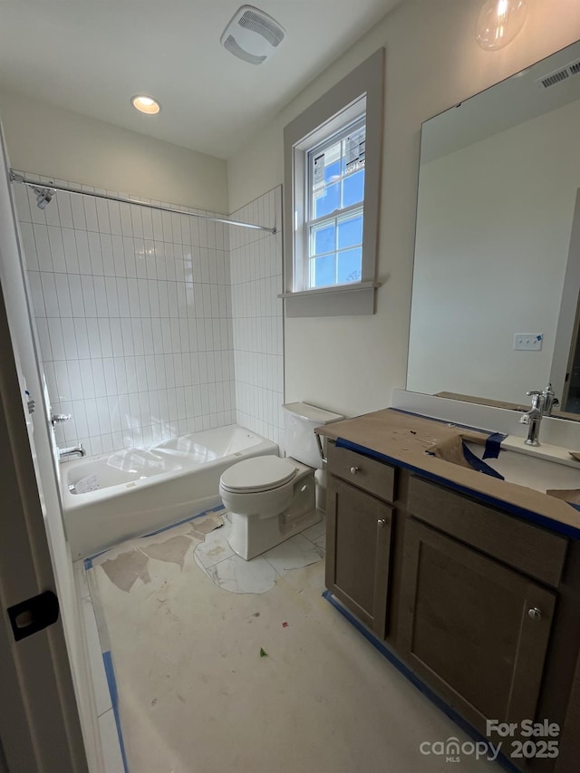 full bathroom featuring vanity, tub / shower combination, and toilet