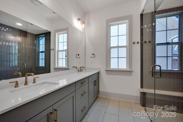 full bathroom featuring a wealth of natural light and a sink