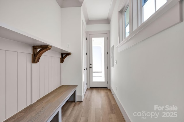 mudroom with light wood-type flooring and baseboards