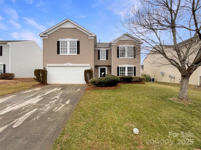 view of front of house with a garage and a front yard