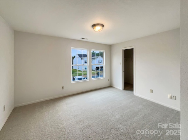 empty room with light colored carpet