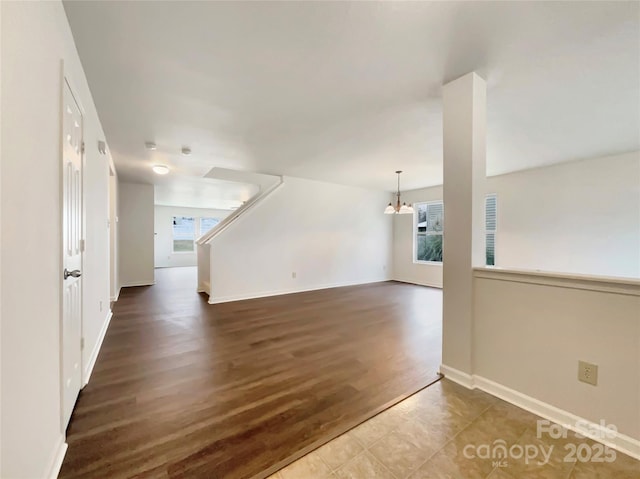 unfurnished living room with dark hardwood / wood-style flooring