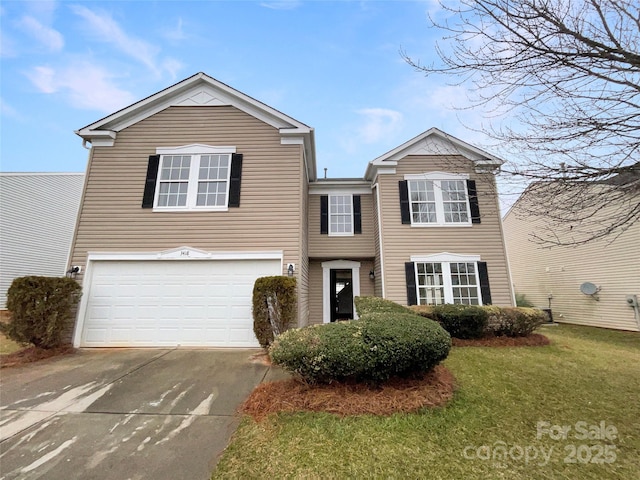 view of front of home with a garage and a front lawn