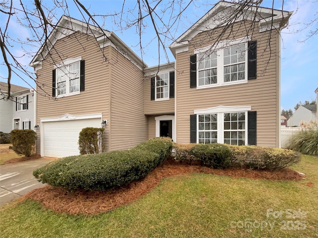 view of front of home featuring a garage and a front lawn