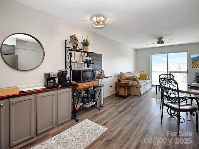 dining space featuring hardwood / wood-style flooring and ceiling fan