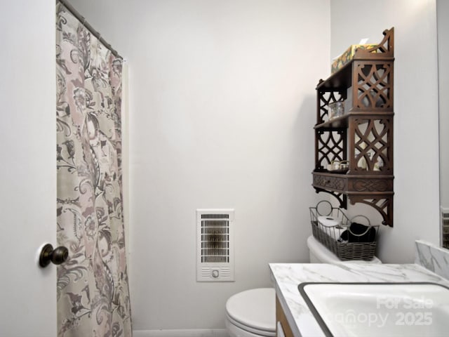 bathroom featuring vanity, toilet, curtained shower, and heating unit