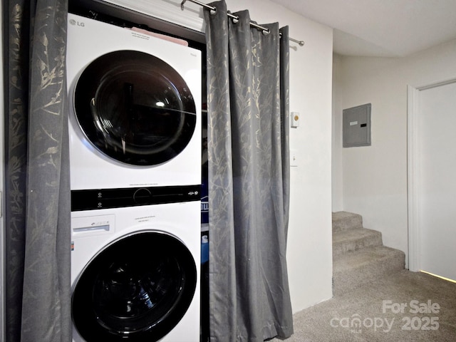 laundry room with stacked washer and clothes dryer, carpet flooring, and electric panel