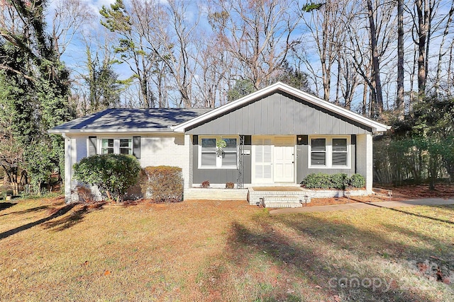 ranch-style house with a front lawn