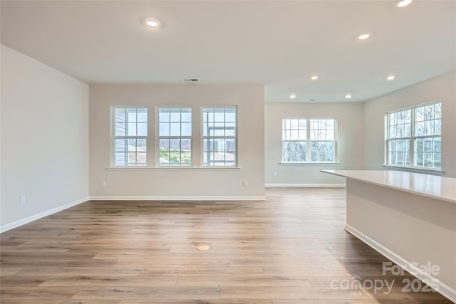 spare room featuring light wood-type flooring