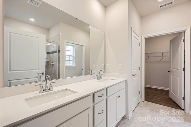 bathroom featuring vanity and walk in shower