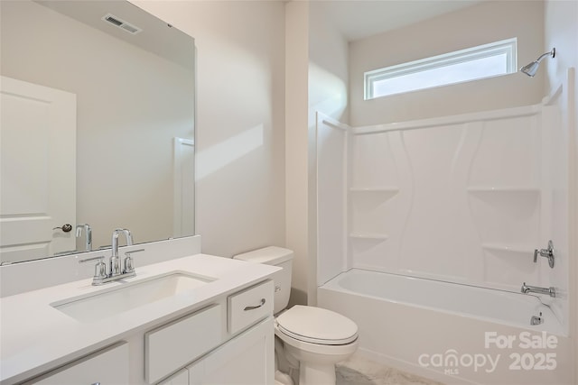 full bathroom with vanity, washtub / shower combination, and toilet