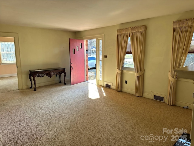 empty room featuring light colored carpet