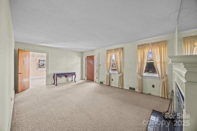 misc room featuring carpet floors and a fireplace