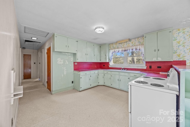 kitchen with electric stove and sink