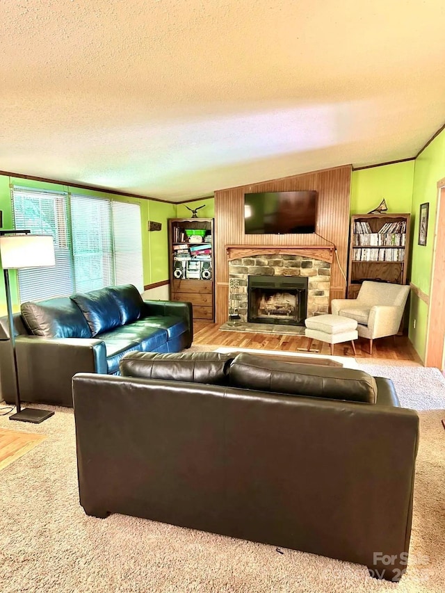 living room featuring wood-type flooring and a textured ceiling