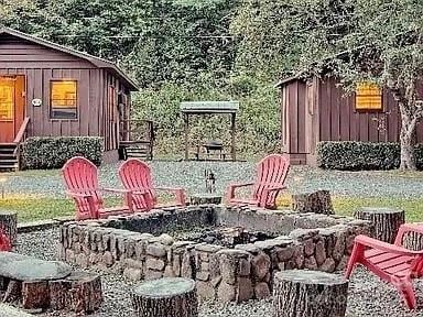 view of yard with a fire pit