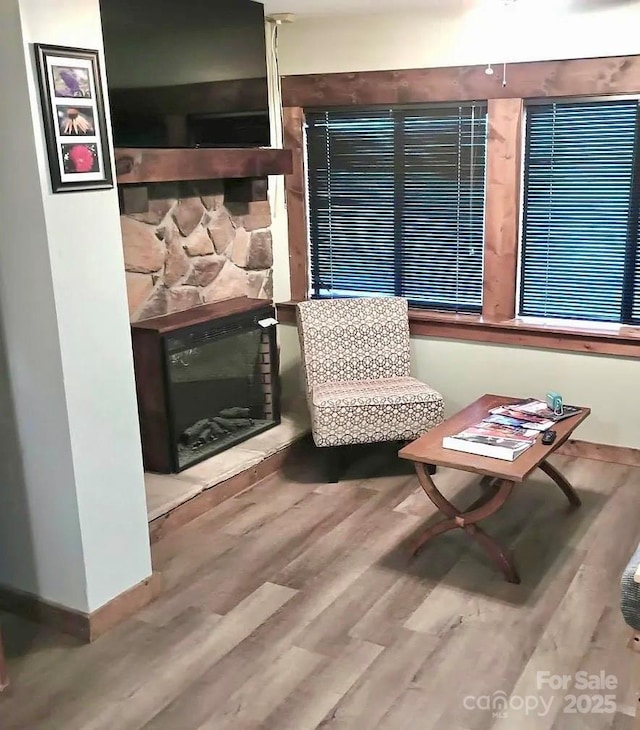 68 Vacation Dr, Whittier, NC 28789 - sitting room with a fireplace and wood finished floors