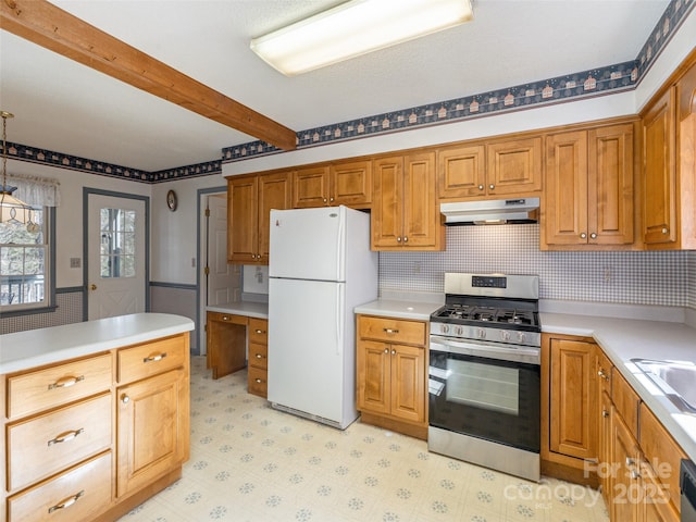 kitchen with hanging light fixtures, stainless steel appliances, and beamed ceiling