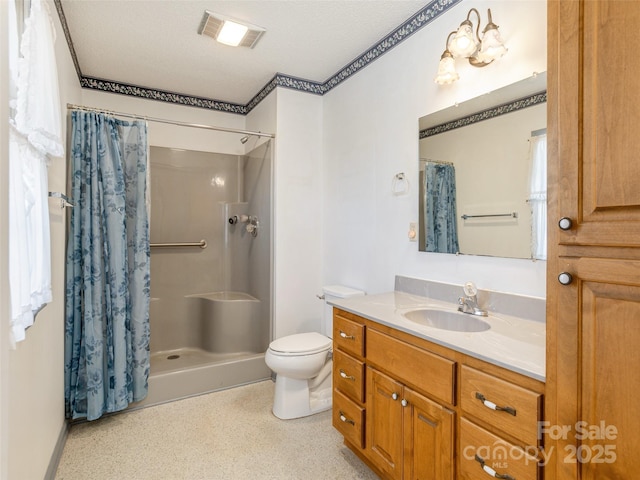 bathroom with vanity, toilet, and curtained shower