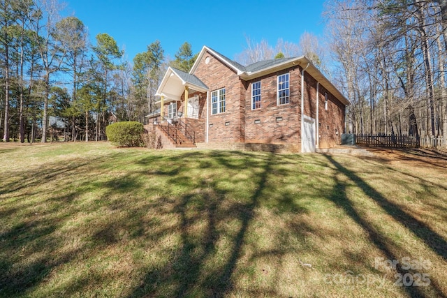 view of property exterior featuring a lawn