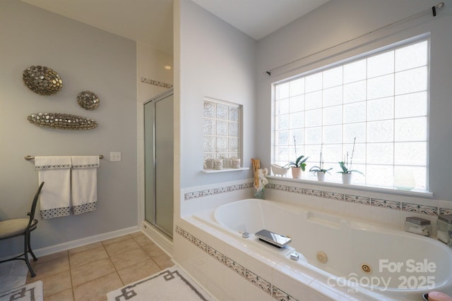 bathroom featuring independent shower and bath, a healthy amount of sunlight, and tile patterned floors