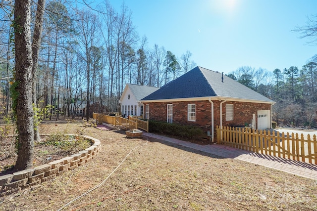 view of side of property with a garage