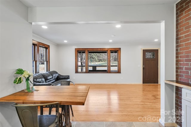 interior space featuring light hardwood / wood-style flooring and ornamental molding