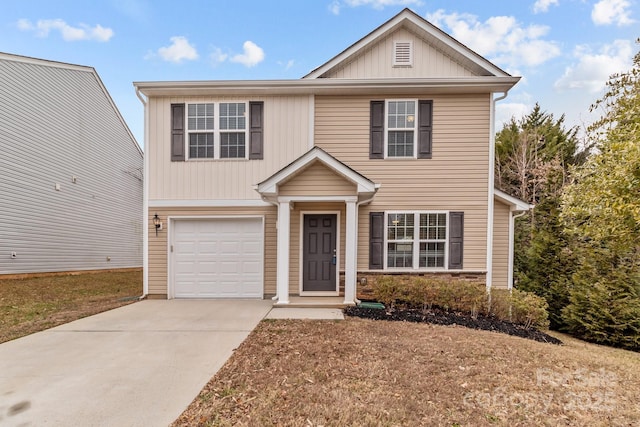 view of front of home featuring a garage and a front lawn