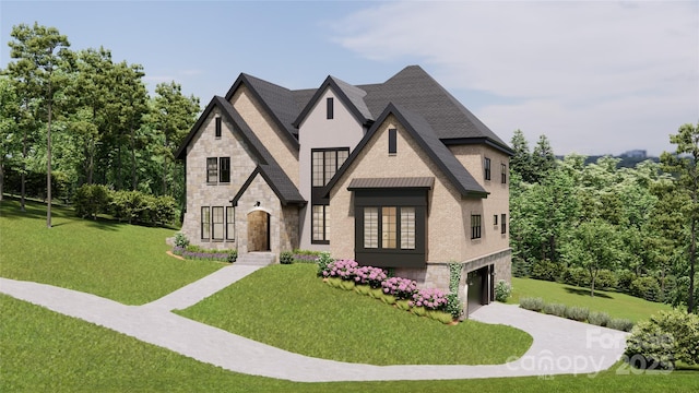 view of front of home featuring a garage and a front yard