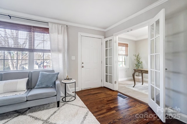 interior space with crown molding and dark hardwood / wood-style flooring